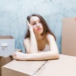 A woman surrounded by boxes