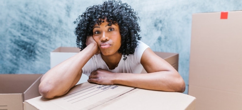 A woman wondering how to avoid mistakes on moving day