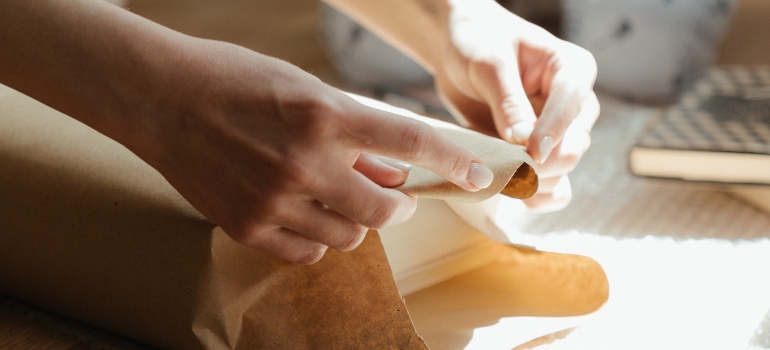 person packing books 