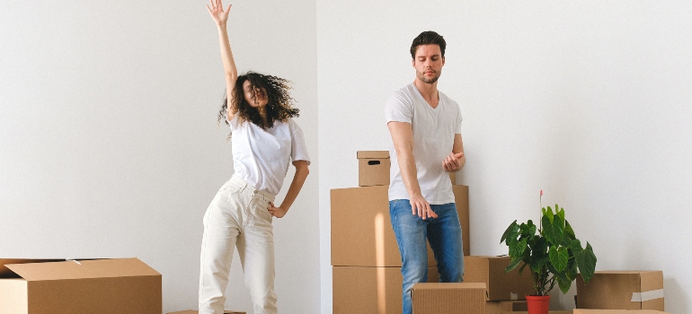happy couple waiting for movers Costa Mesa 