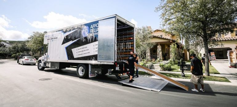 Affordable Reliable Moving and Storage's Orange movers on the job