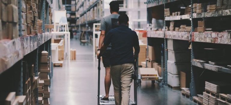 People walking through storage facility