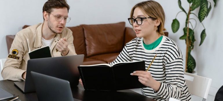 A man and a woman talking about moving services