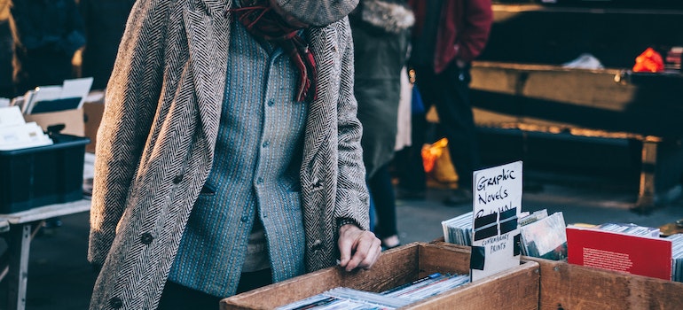 Person standing in front of a brown crate