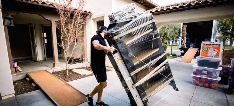 one of movers Laguna Niguel carrying furniture