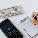 Man counting how to reduce house moving costs