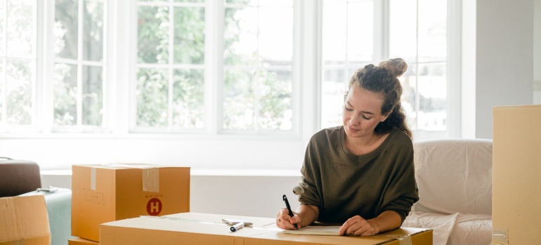 Woman making a plan on moving while working remotely
