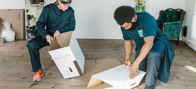 white glove delivery service staff assembling boxes inside the apartment