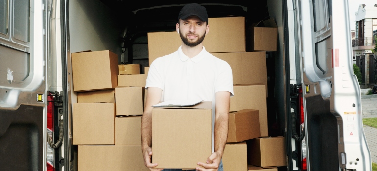 A man holding a moving box 