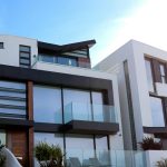a modern house with lots of glass elements