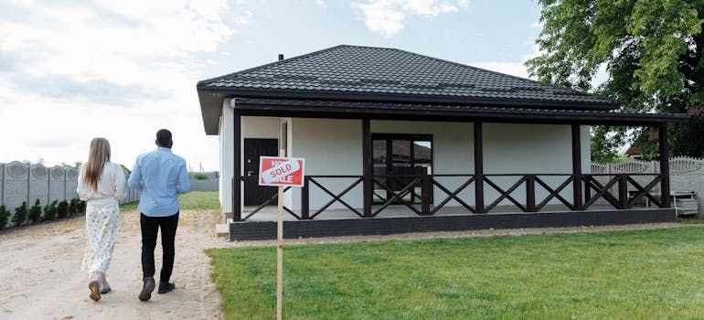 a house that has just been sold and a couple entering in one final time
