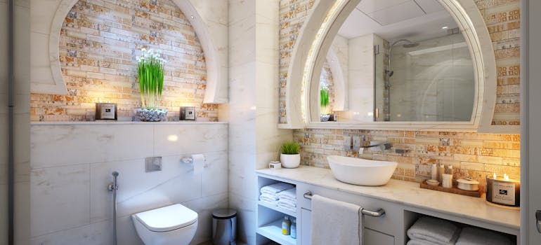 an elegant bathroom with many nice hotel-like additions